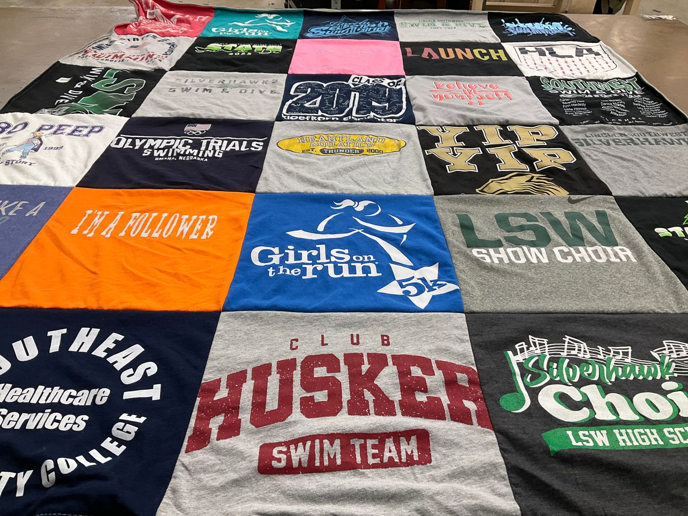 T-shirt quilt featuring club husker swim team by Kristen from NE