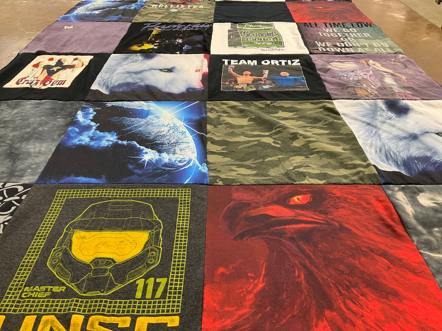 T-shirt quilt with gaming, music themes by Susan from MA
