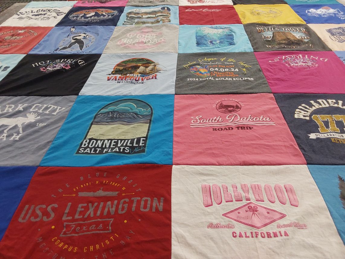 T-shirt quilt with travel, tourism themes by Lenette from TX