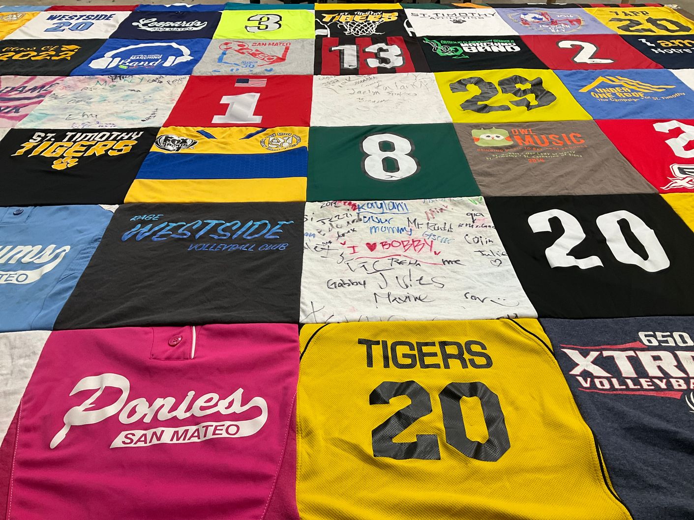T-shirt quilt featuring st timothy tigers, san mateo ponies by Lizette from CA