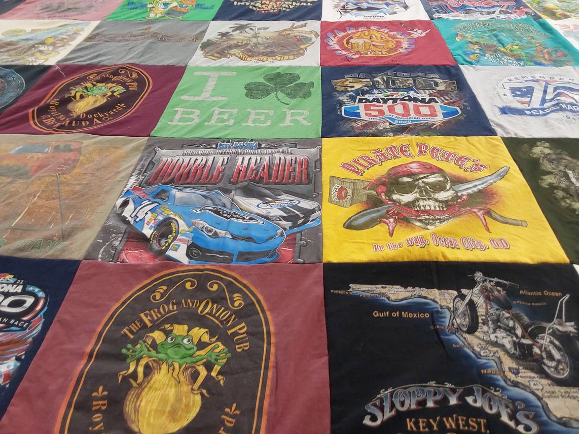 T-shirt quilt with racing, pirate themes by peter from NJ