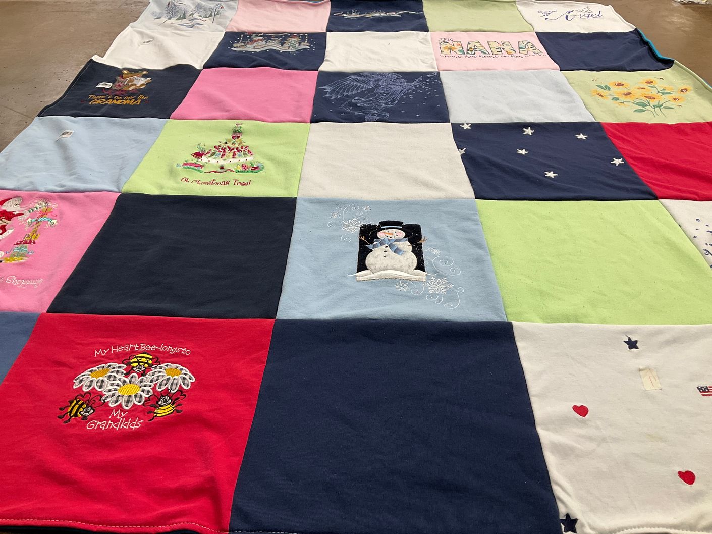 T-shirt quilt with family, holiday themes by Katherine from OH