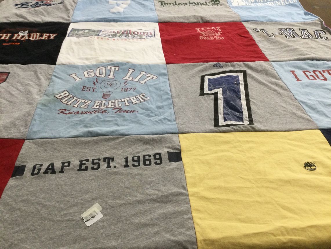 T-shirt quilt with racing, electricity themes by Christine from MA