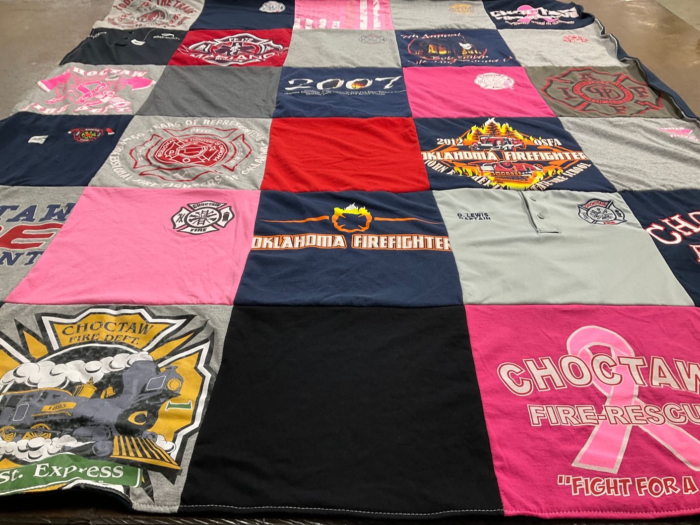T-shirt quilt with firefighting, community service themes by Donna from OK