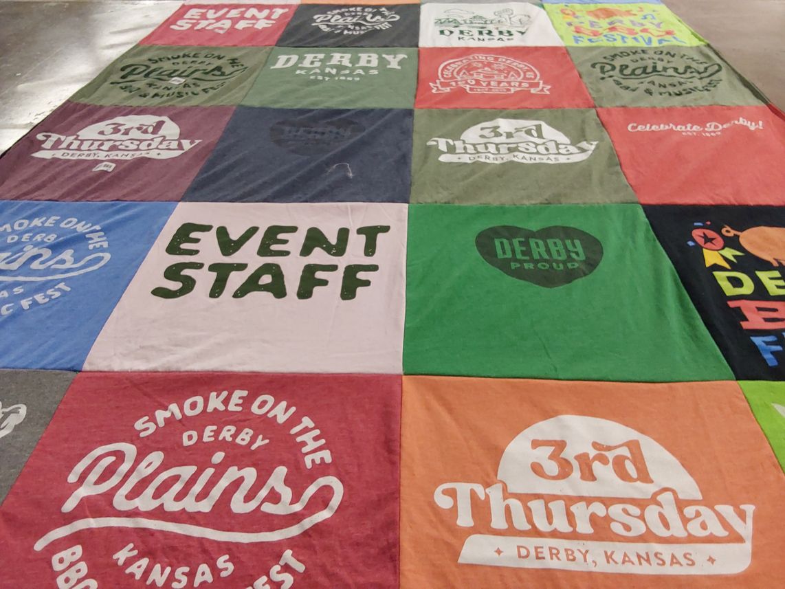 T-shirt quilt with local events, community festivals themes by Kristy from KS