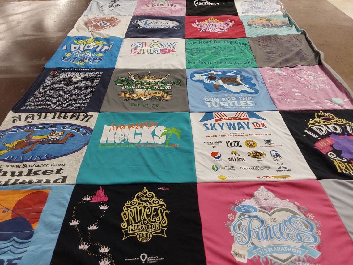 T-shirt quilt with running, diving themes by Christopher from NY
