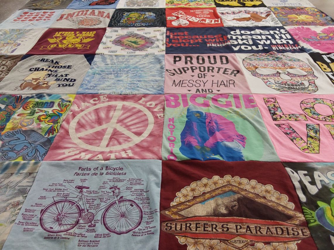 T-shirt quilt with bicycles, music themes by Anna from FL