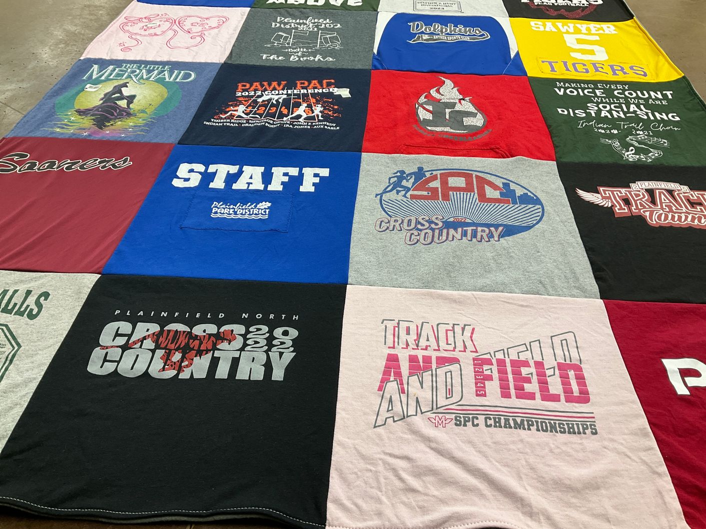 T-shirt quilt featuring plainfield north cross country, plainfield north track and field by Jamie from IL