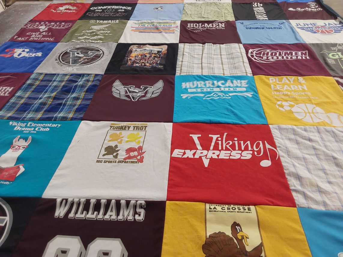 T-shirt quilt featuring hurricane swim team by Jacqueline from WI
