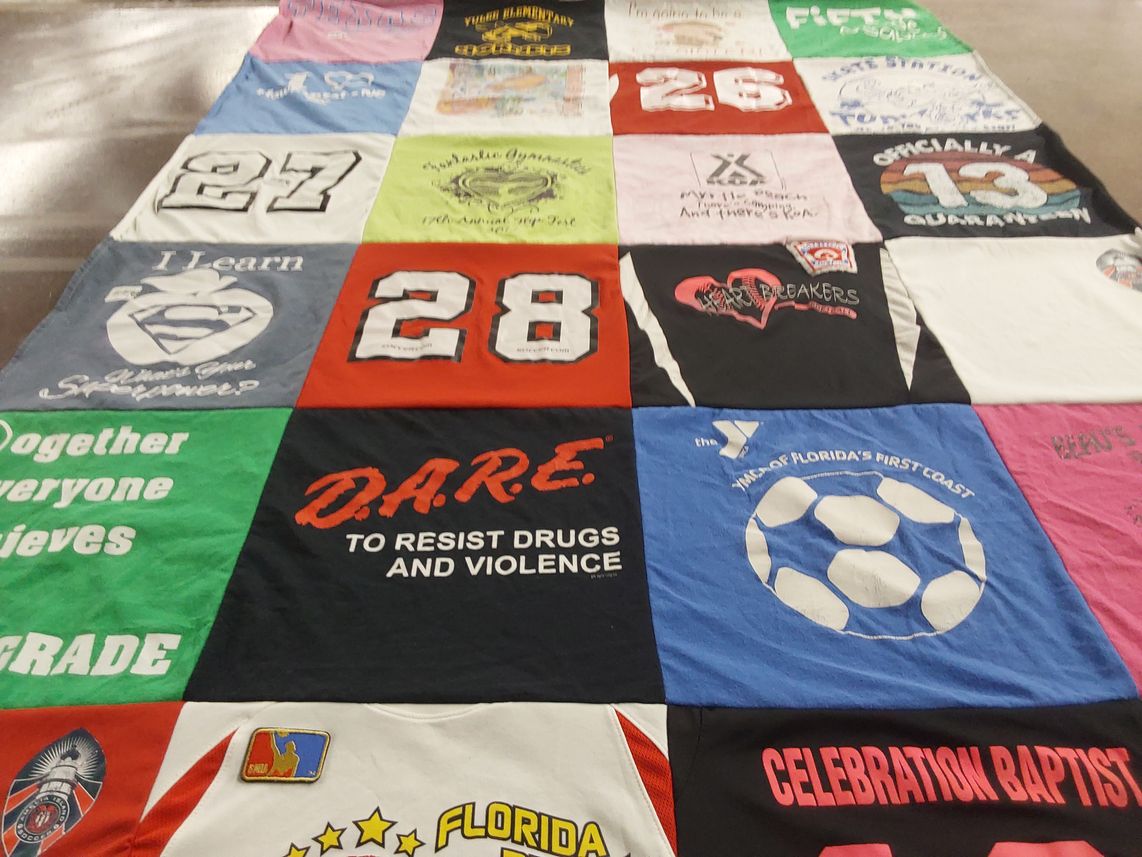 T-shirt quilt with education, sports themes by Alana from FL