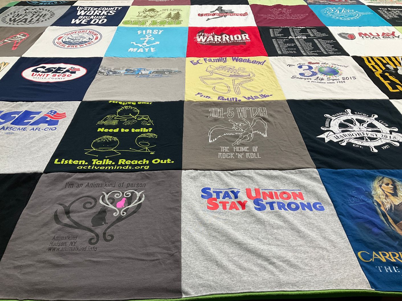 T-shirt quilt with community service, animal rights themes by Tina from NY