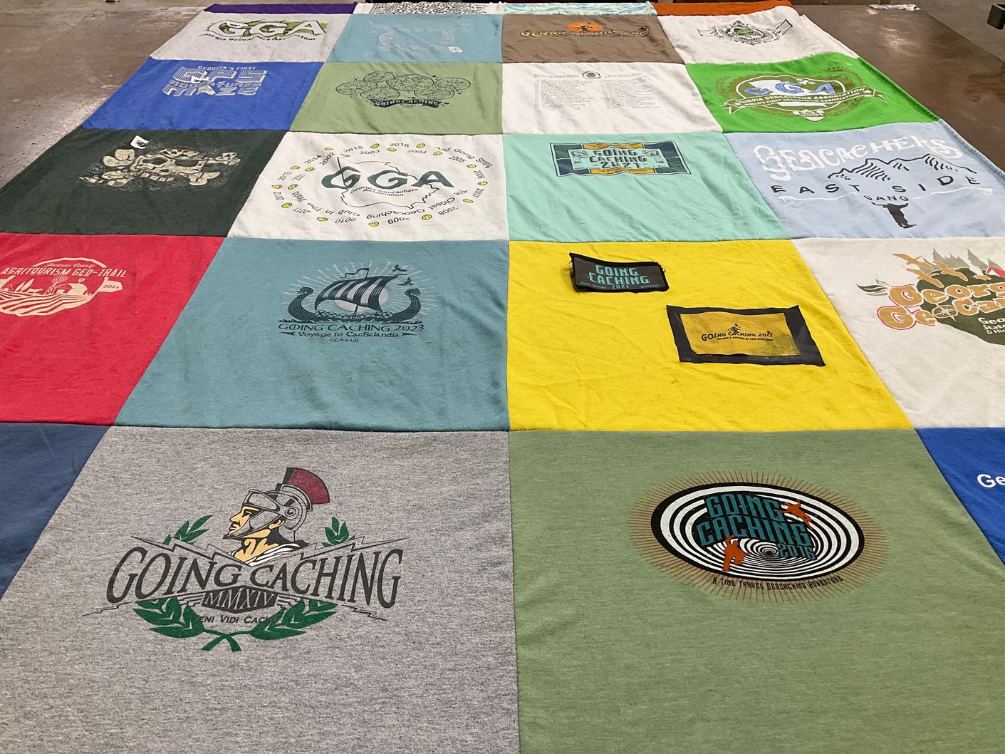 T-shirt quilt with geocaching themes by Nancy from GA