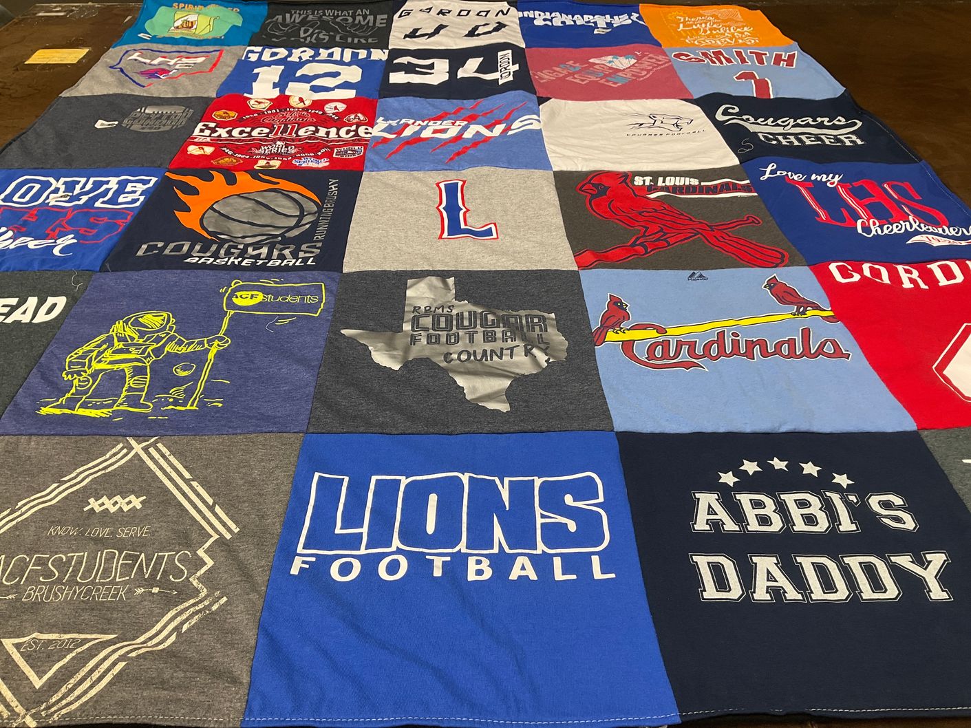 T-shirt quilt featuring cougars, lions by Jason from TX