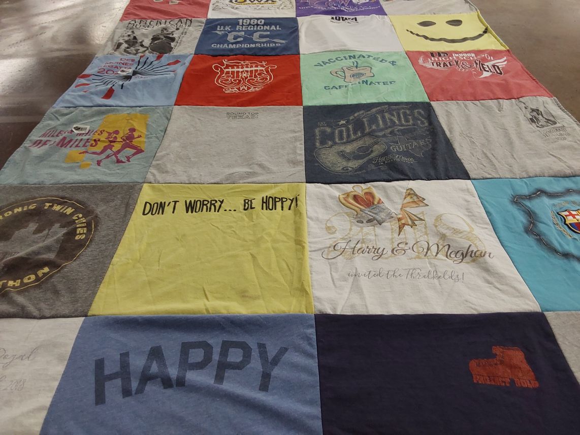 T-shirt quilt with running, music themes by Bronwyn from IA