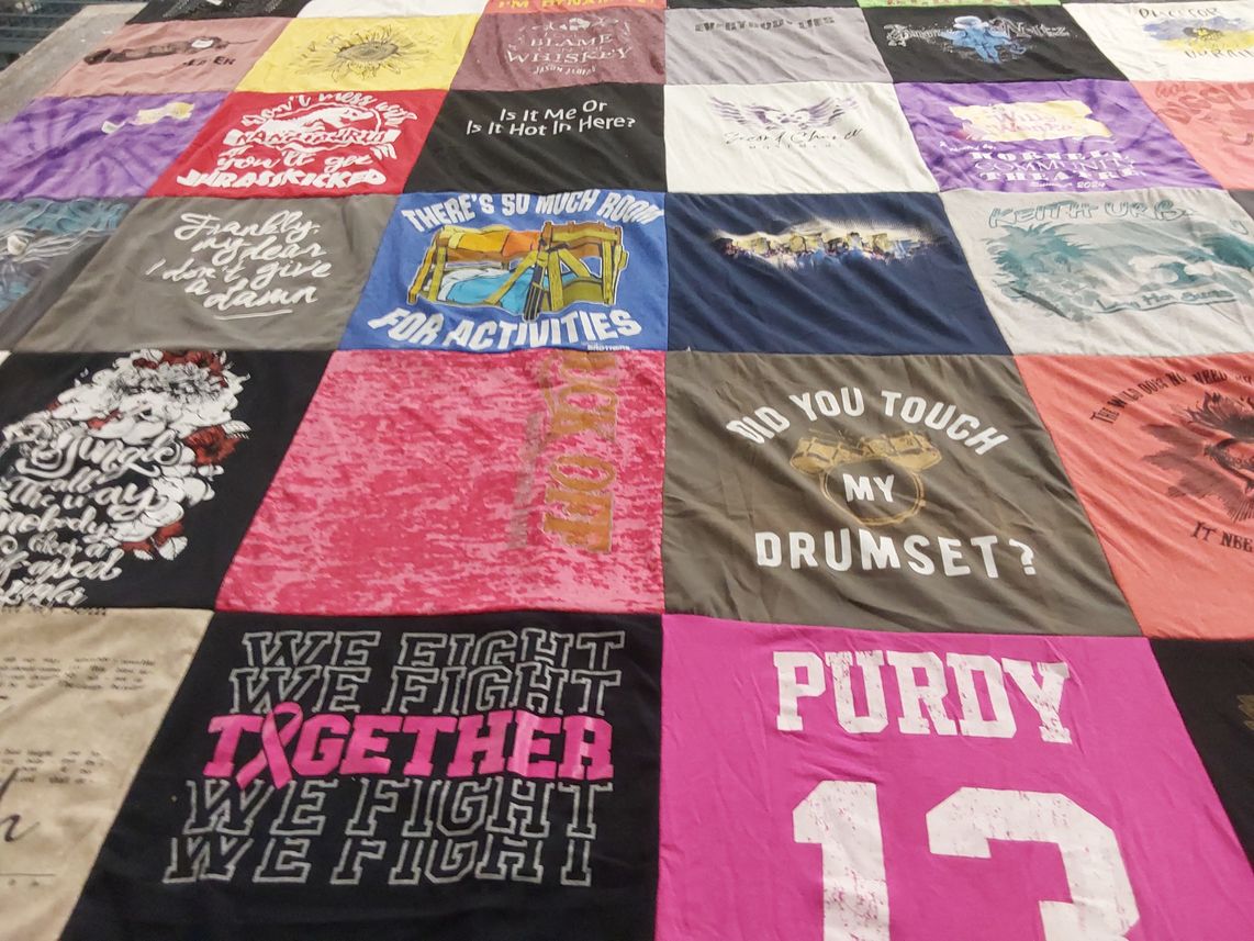 T-shirt quilt with music, activism themes by Anne from NY