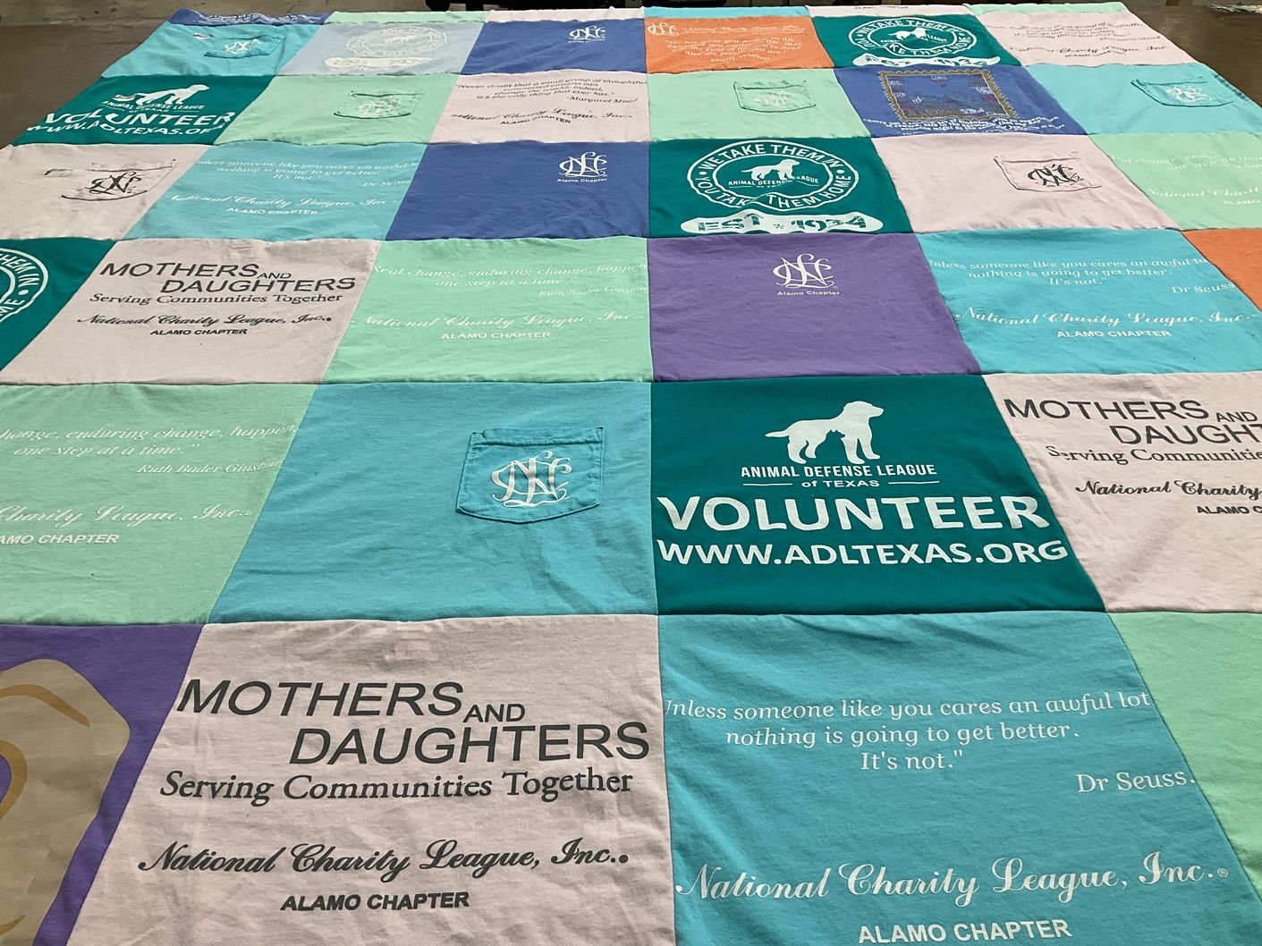T-shirt quilt with volunteering, community service themes by Virginia from TX
