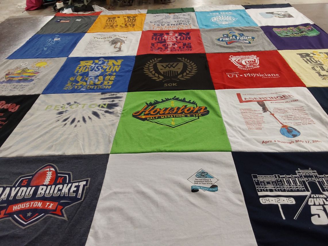 T-shirt quilt with running, theatre themes by Tonyamas from TX