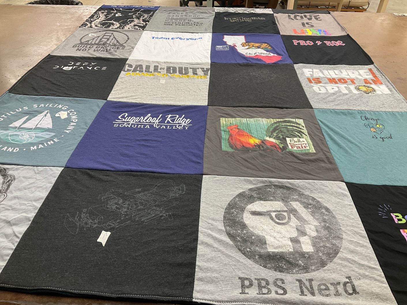 T-shirt quilt with video games, sailing themes by Heather from CA