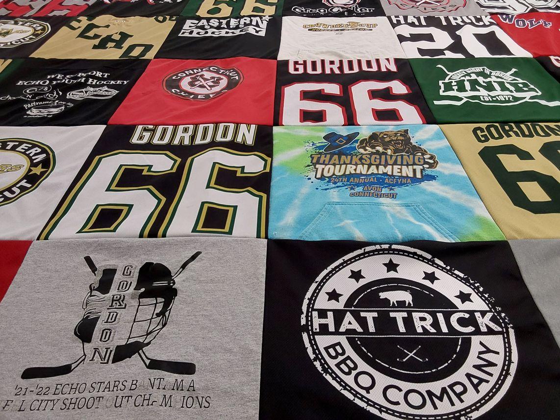 T-shirt quilt with hockey, bbq themes by Kristen from CT