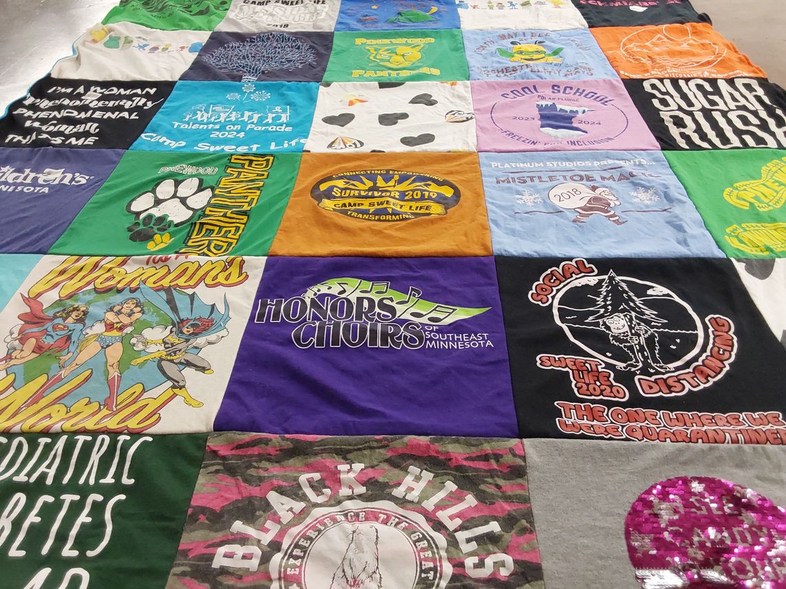 T-shirt quilt with camping, singing themes by Beth from MN