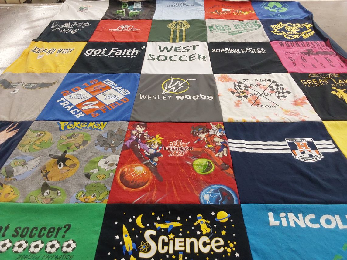 T-shirt quilt featuring zeeland track and field, west soccer by Kim from MI
