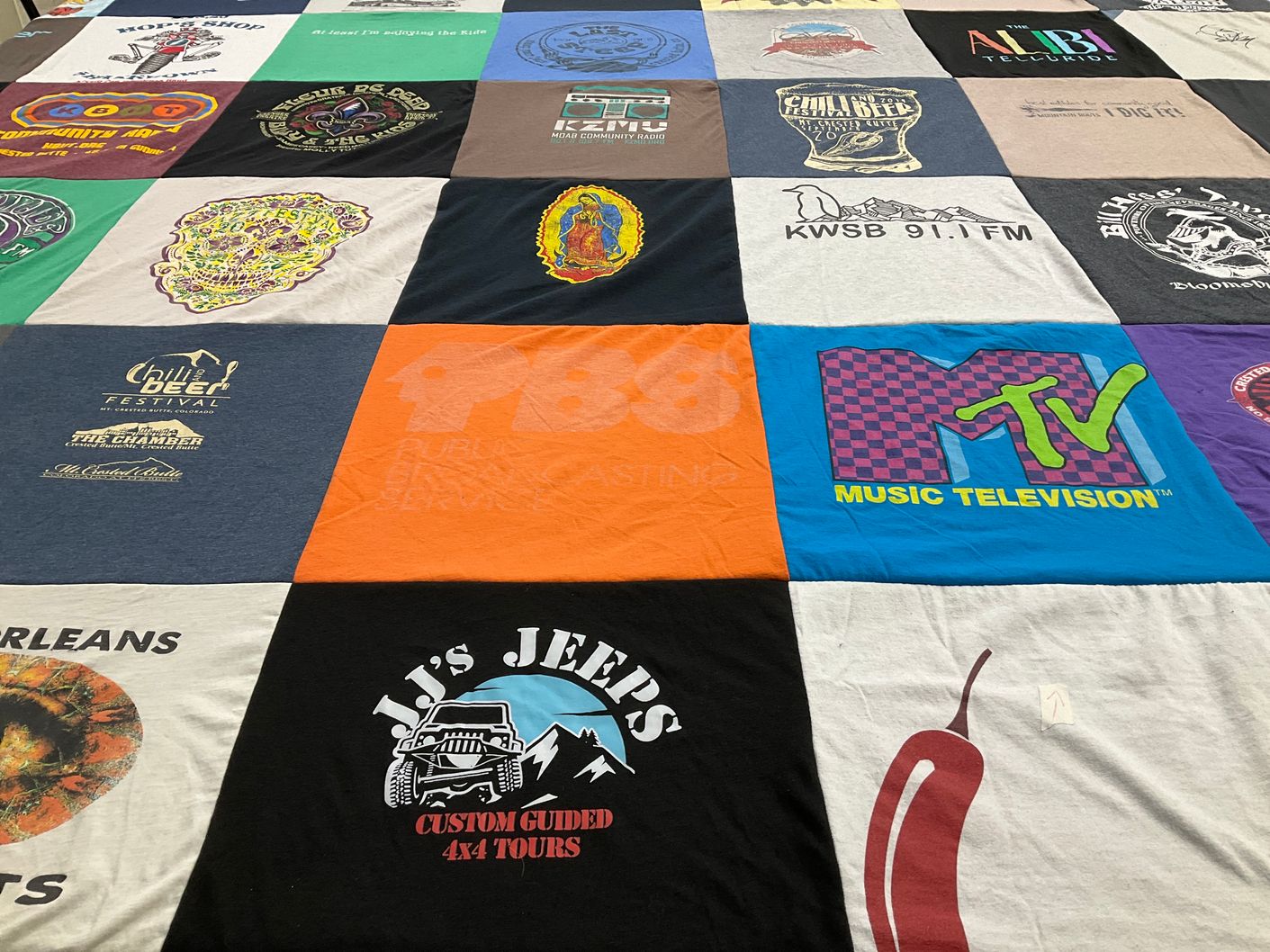 T-shirt quilt with music, beer festivals themes by Tyler from CO