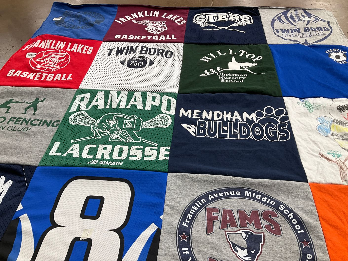T-shirt quilt featuring ramapo lacrosse, mendham bulldogs by Lena from NJ