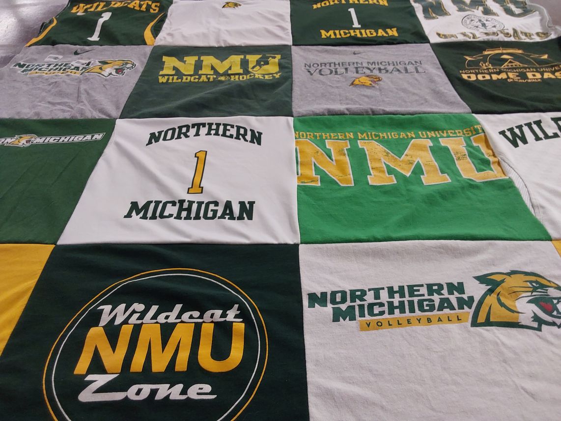 T-shirt quilt featuring northern michigan university wildcats by Megan from MN