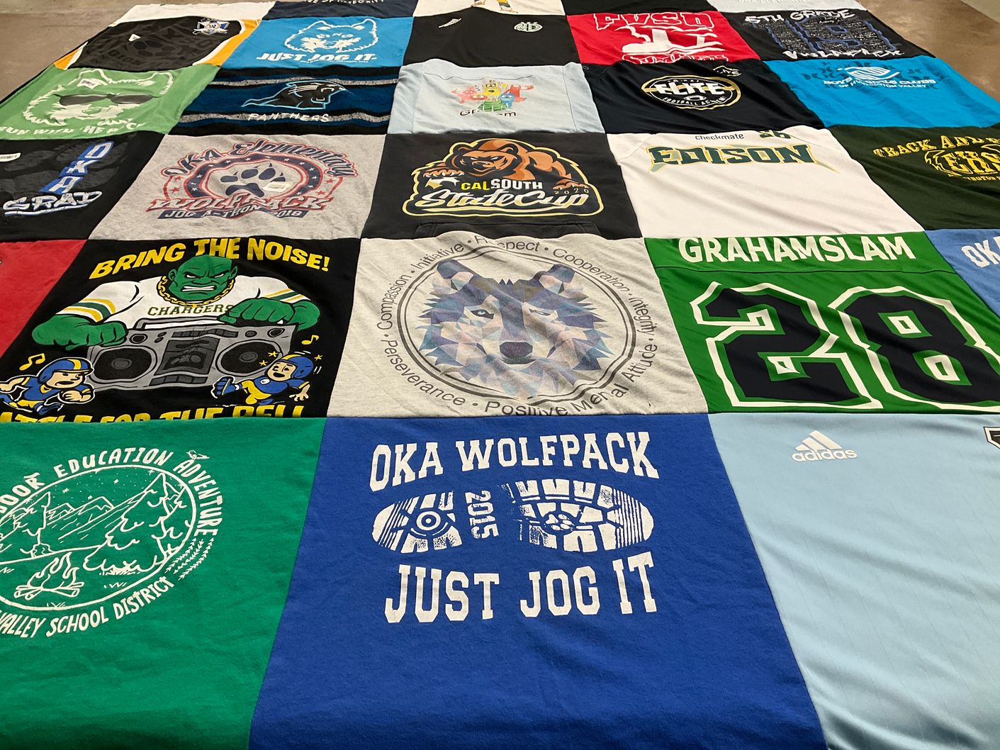 T-shirt quilt featuring oka wolfpack by Sarah from CA
