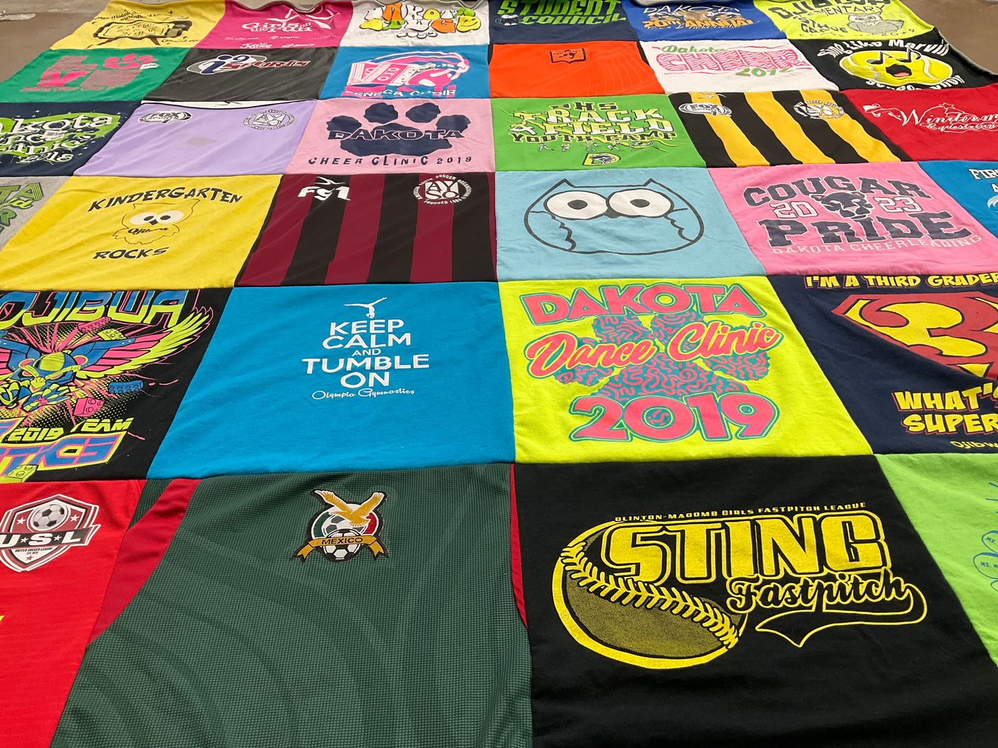 T-shirt quilt featuring dakota cheerleading team by Jennifer from MI