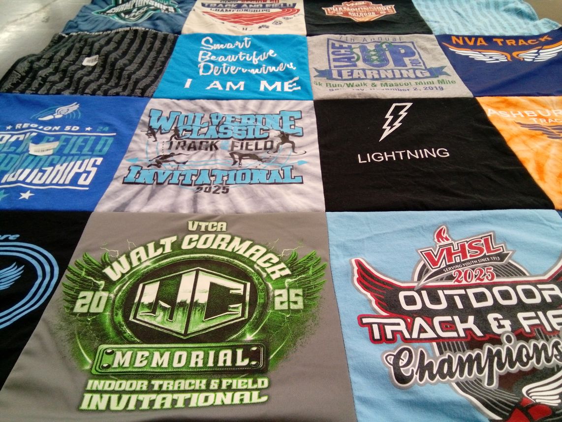 T-shirt quilt featuring wolverine track and field invitational, nva track by June from VA