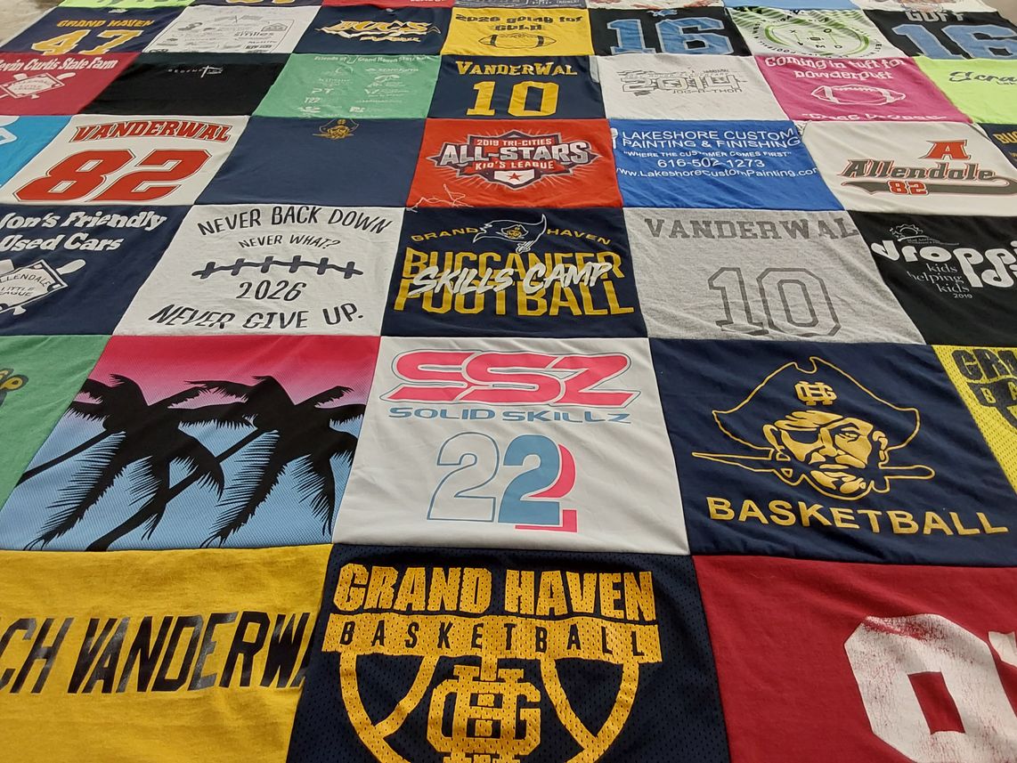 T-shirt quilt featuring buccaneer football, grand haven basketball by Erin from MI