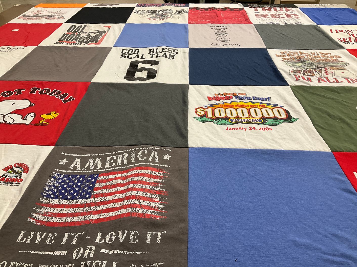 T-shirt quilt with community themes by robin from WI