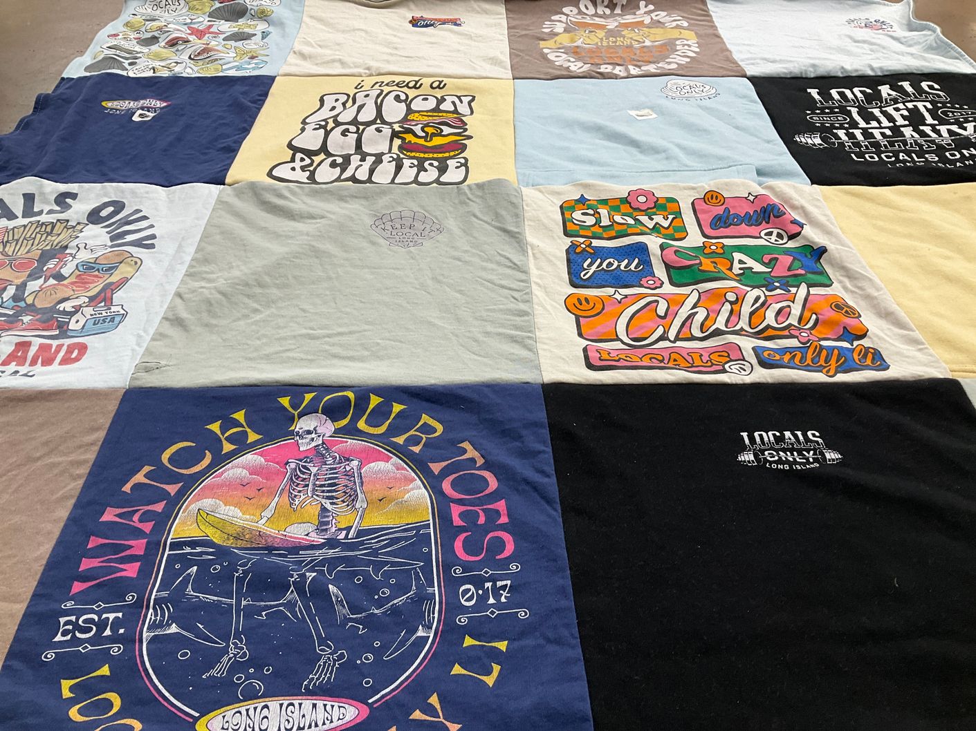 T-shirt quilt with food, local culture themes by Anna from NY