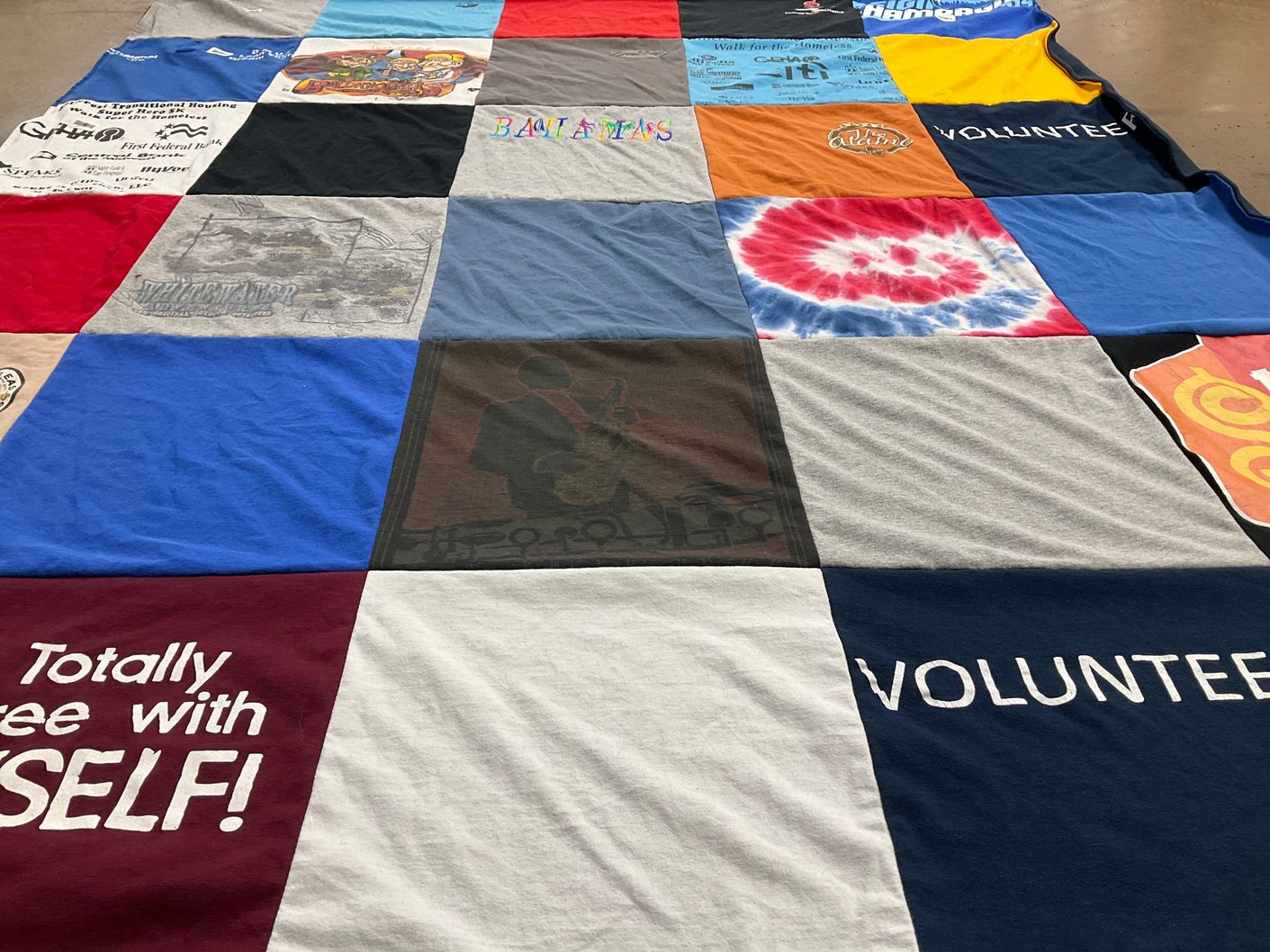 T-shirt quilt with volunteering, community service themes by Sharon from MO