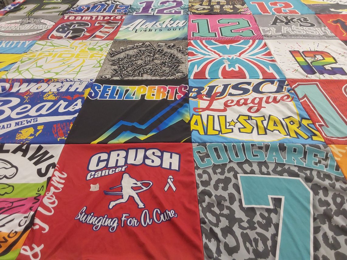 T-shirt quilt with fundraising, sports themes by Alaina from AK