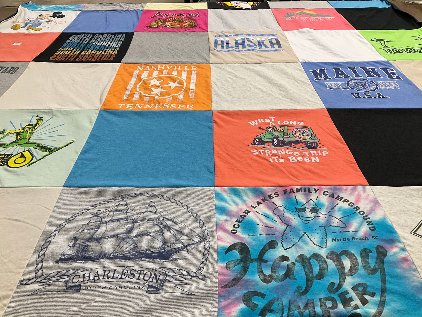 T-shirt quilt with camping, travel themes by Victoria from SC