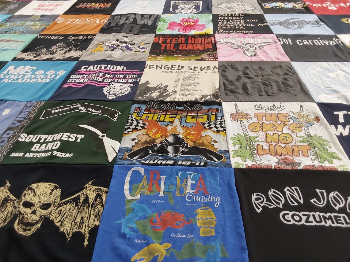 T-shirt quilt with travel, music themes by Coty from TX