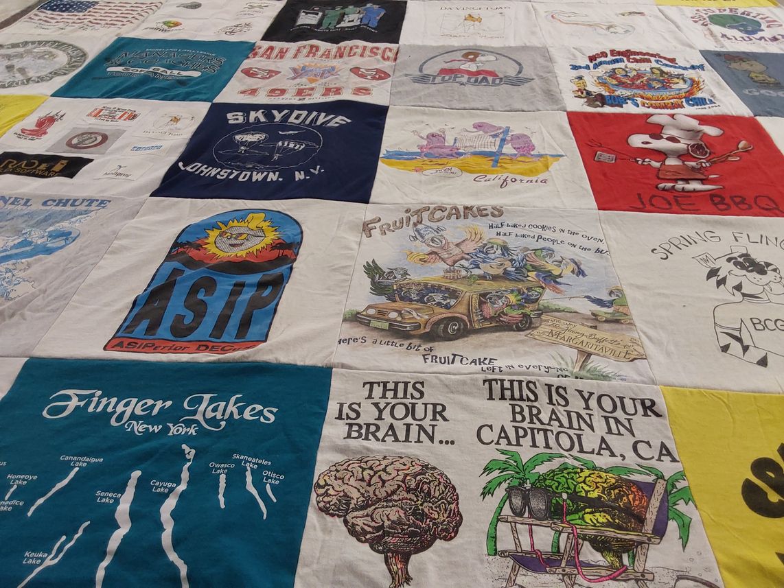 T-shirt quilt with skydiving, cooking themes by Nancy from NV
