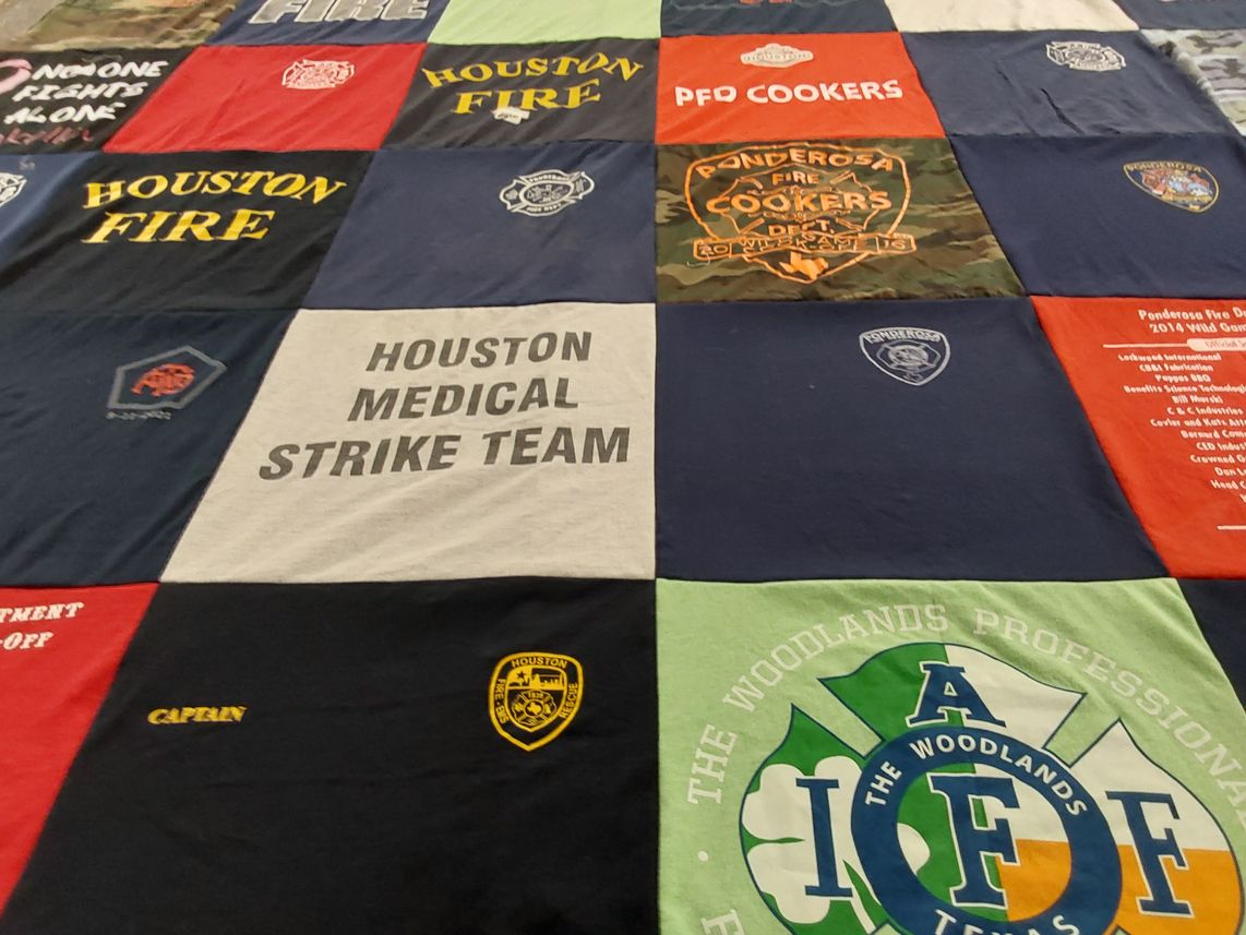 T-shirt quilt with firefighting, community service themes by Rhonda from TX
