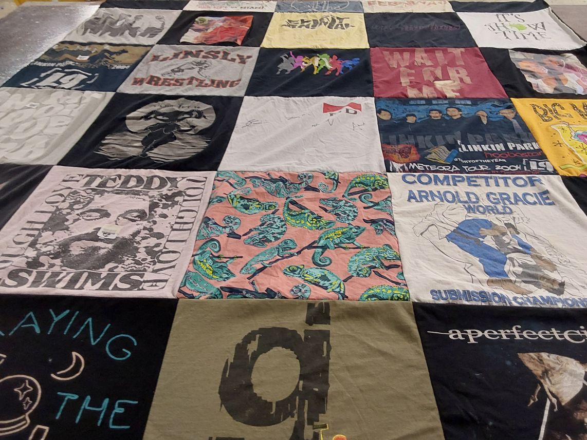 T-shirt quilt with music, wrestling themes by Teresa from PA