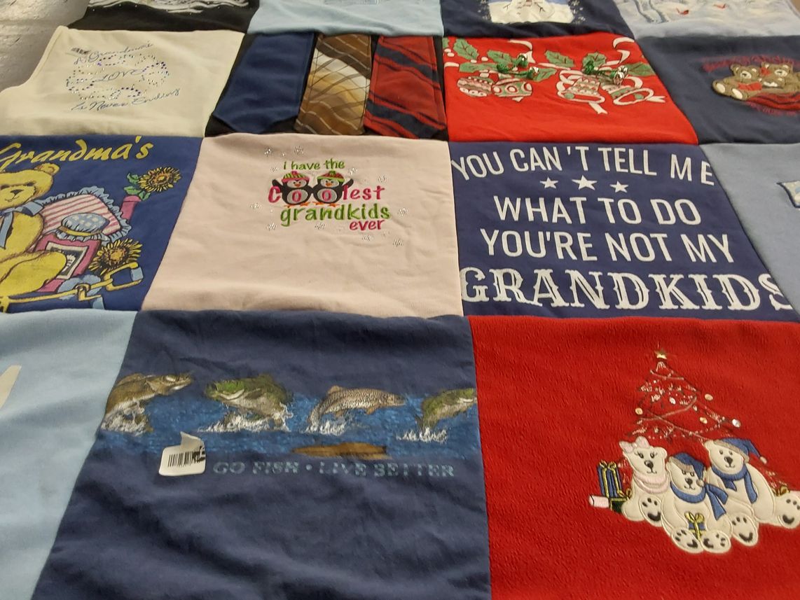 T-shirt quilt with family, fishing themes by Donna from IN