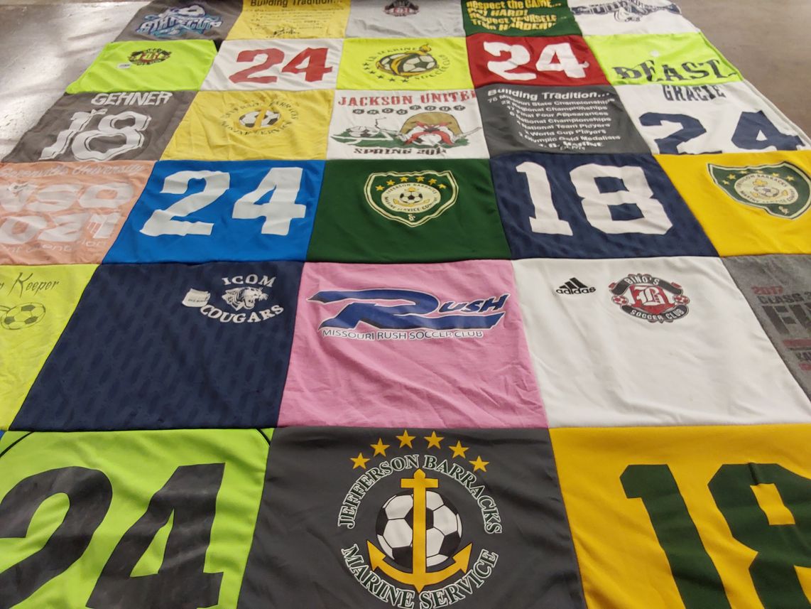 T-shirt quilt with soccer themes by JoAnn from MO