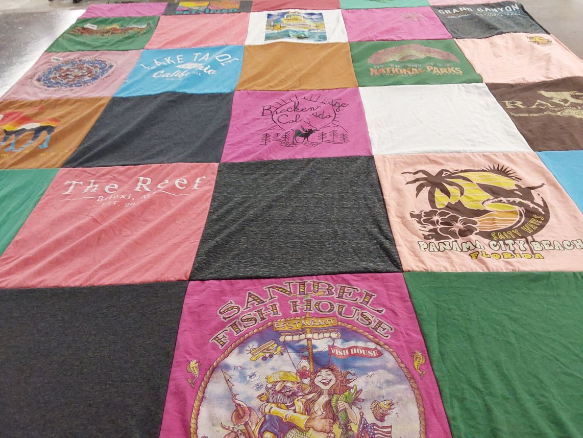 T-shirt quilt with beaches, travel themes by Maria from KS