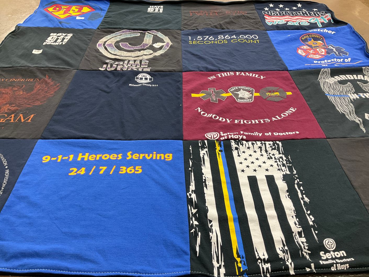 T-shirt quilt with emergency services, public safety themes by Jennifer from TX