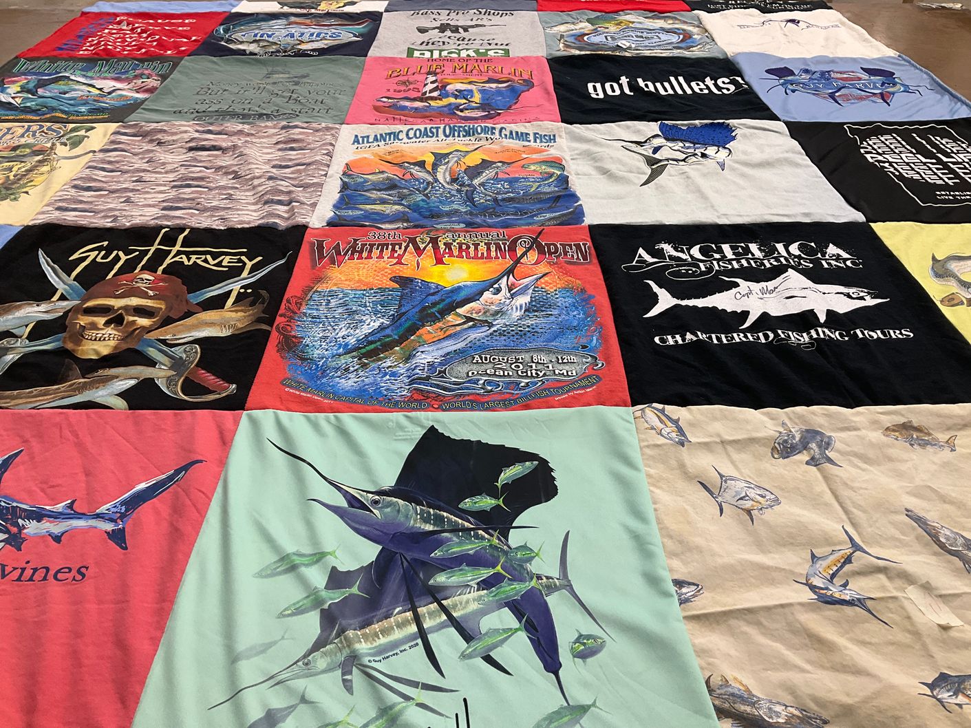 T-shirt quilt with fishing, marine life themes by Susan from PA