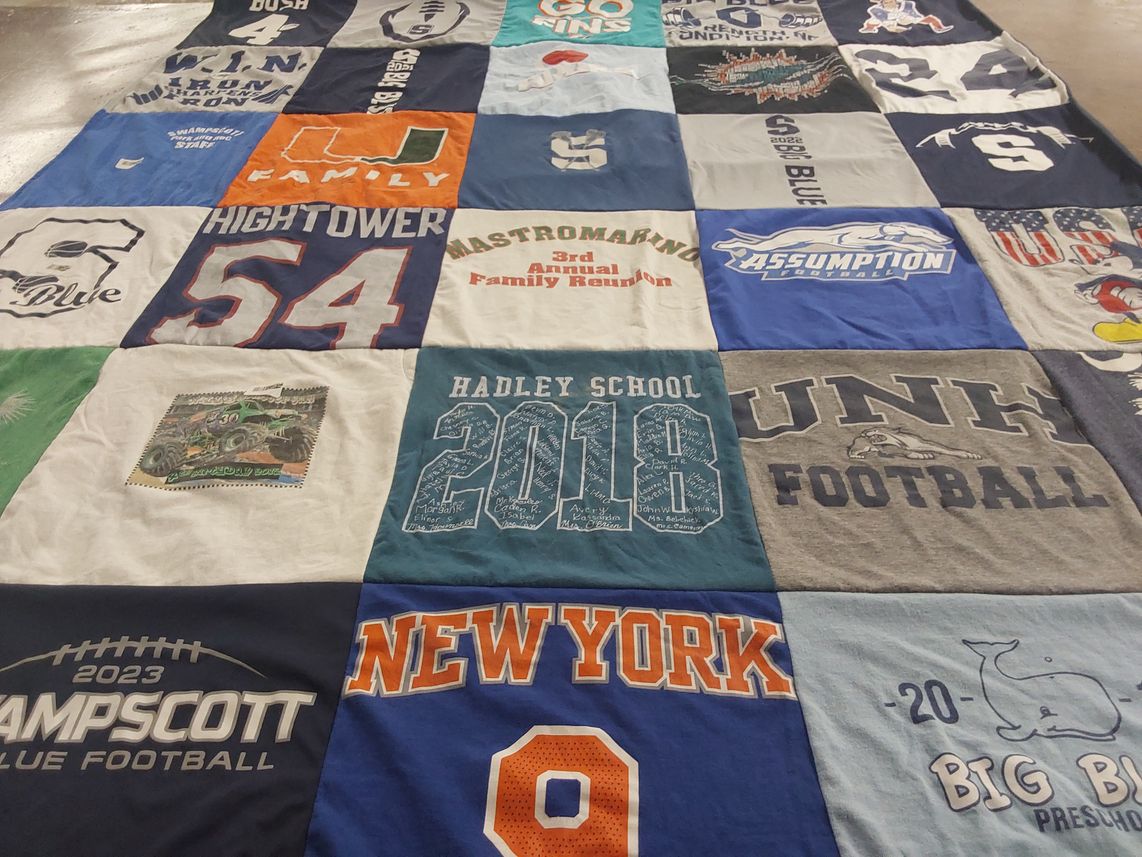 T-shirt quilt featuring campscott blue football, unh football by Gina from MA