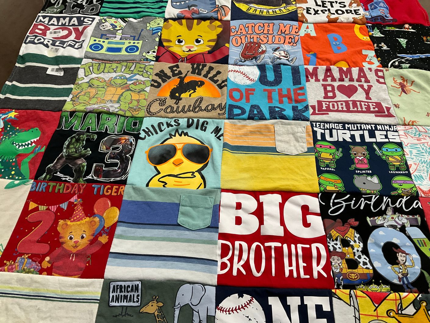 T-shirt quilt with cartoons, superheroes themes by Mario from TX
