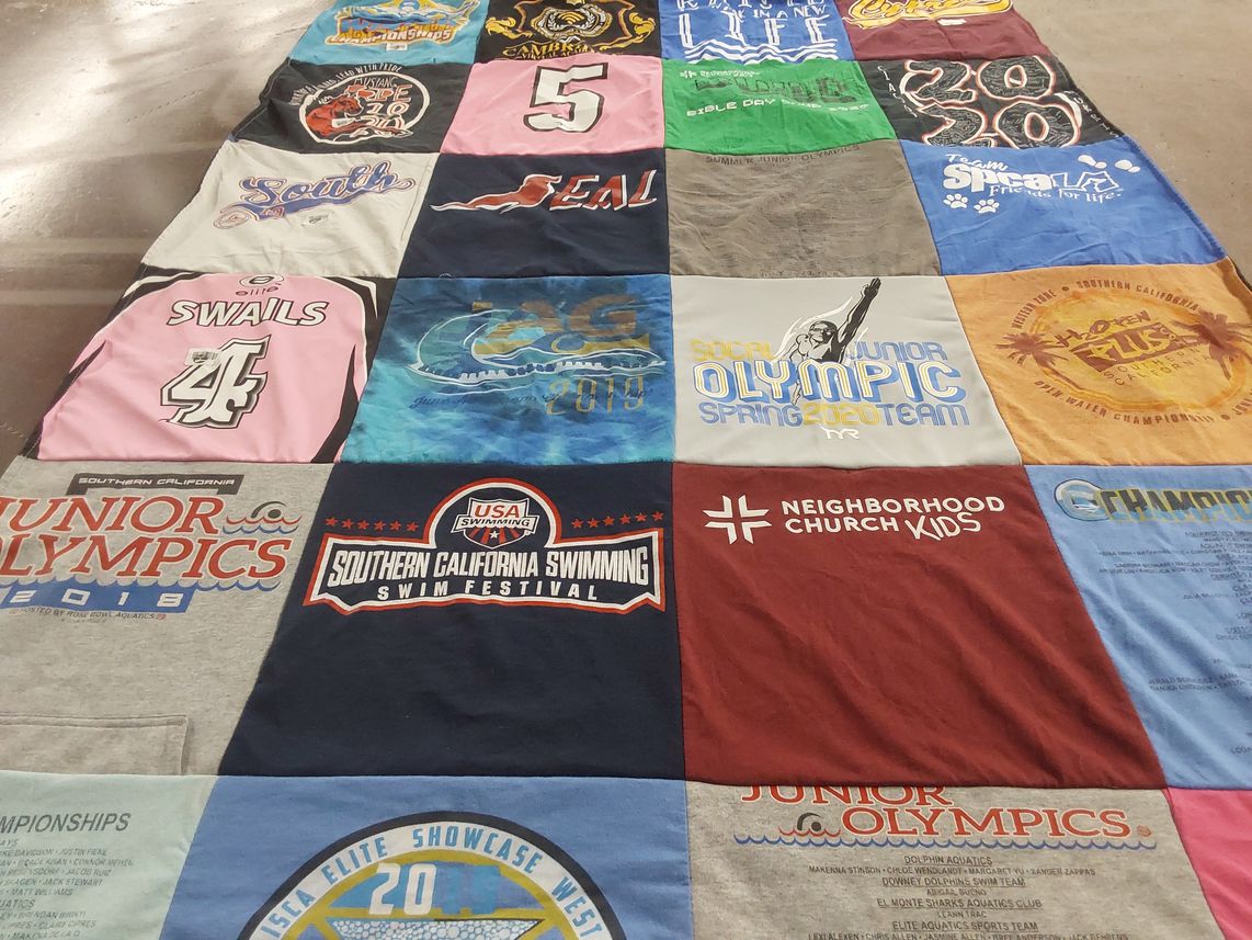 T-shirt quilt with swimming, youth sports themes by Bernadette from CA