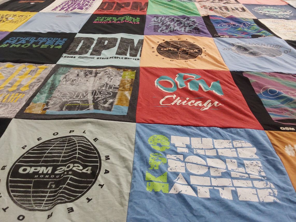 T-shirt quilt with community, activism themes by Jeanna from IN